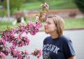 IMG_3073 Amanda smelling pink blossoms